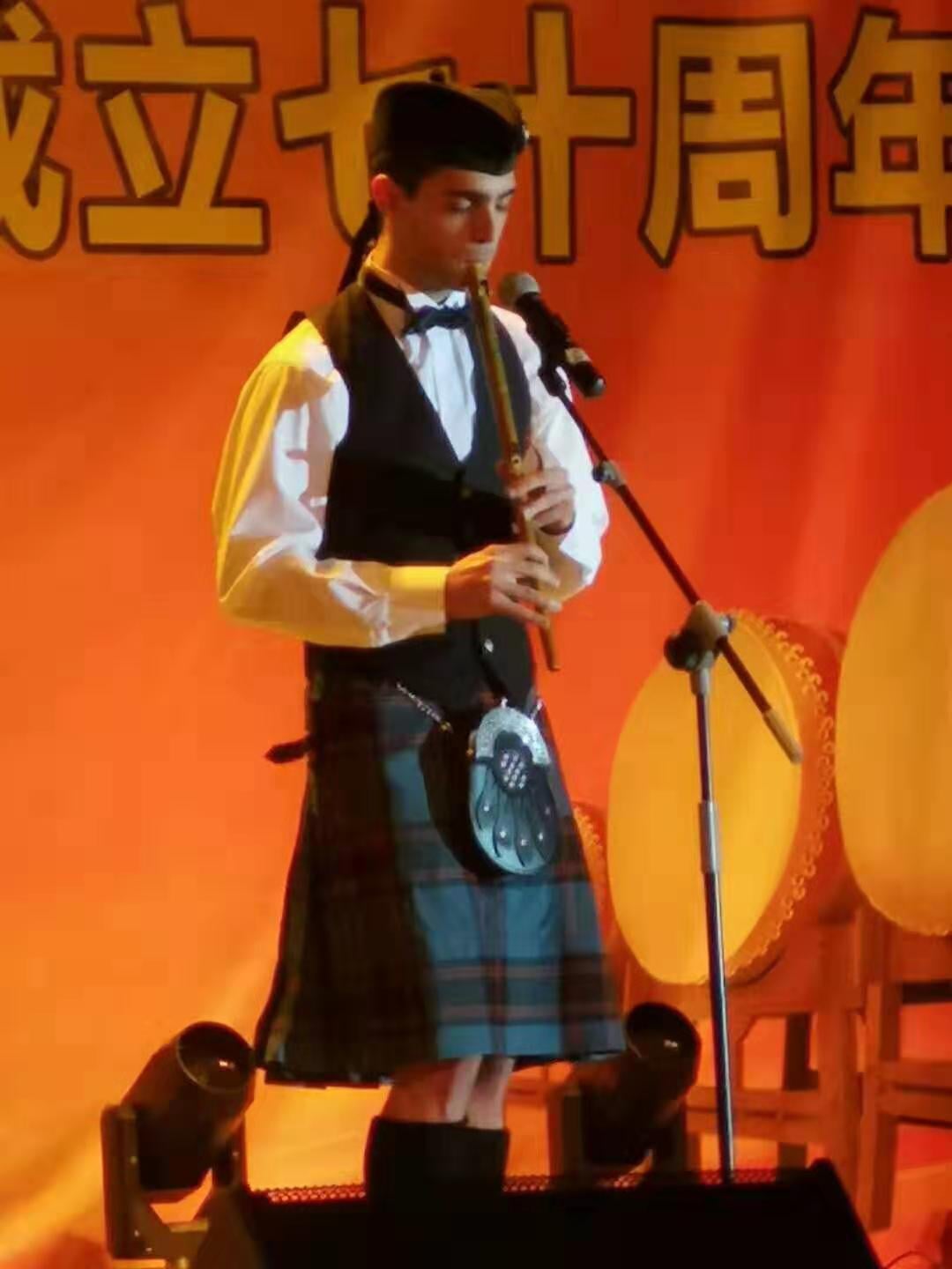 Performing on the Irish low whistle in Gansu Province, China, 2019